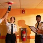 Fire safety inspectors evaluating fire safety systems to ensure compliance and safety