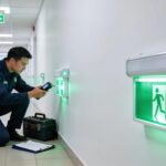Emergency lighting system inspection in a commercial building showcasing compliance and safety standards